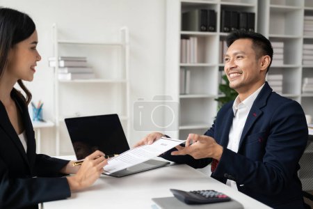 Job application concept: Manager and job applicant shake hands after a job interview. Job interviews to find people to join the company and talented people to work with
