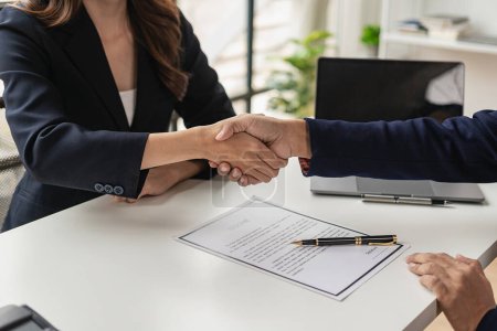 Photo for Job application concept: Manager and job applicant shake hands after a job interview. Job interviews to find people to join the company and talented people to work with - Royalty Free Image