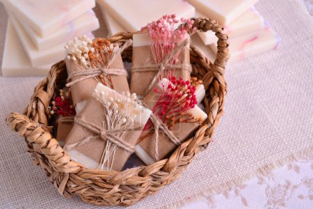 Photo for Wedding favors mini soaps with flowers in wicker basket, sustainable small gifts for party guests, ecological plastic free event souvenir - Royalty Free Image
