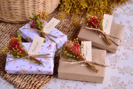Wedding decoration favors handmade soaps small gifts, guest souvenir craft and floral style box with jute ribbon and flowers arrangement