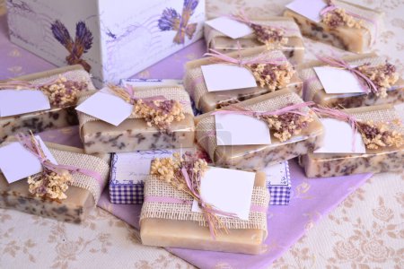 Wedding favours handmade natural lavender soaps with jute and flowers decoration, purple color party, small gifts for guests, country style celebration, favor table with souvenirs