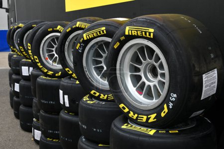 Photo for Scarperia, Italy, 21 October 2022 - Yellow Pirelli tires mounted on alloy wheels in the paddock of the Mugello circuit during the ACI CSAI Racing Weekend 2022. - Royalty Free Image