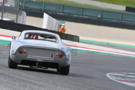 Photo for Scarperia, 3 April 2022: Porsche 904 GTS 1964 in action during Mugello Classic 2022 at Mugello Circuit in Italy. - Royalty Free Image