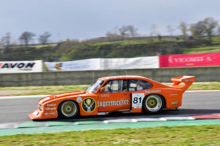 Photo for Scarperia, 2 April 2023: Ford Capri Turbo Gr 5 Jagermeister DRM year 1982 ex Klaus Ludwig in action during Mugello Classic 2023 at Mugello Circuit in Italy. - Royalty Free Image