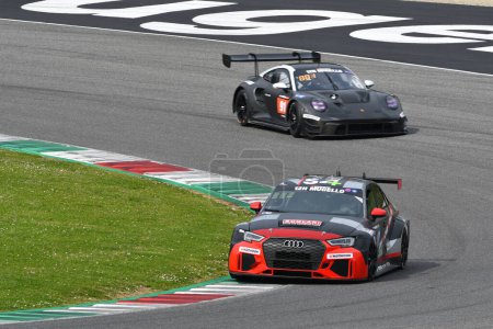 Photo for Scarperia, 23 March 2023: Audi RS3 LMS DSG TCR of Team AIKOA Racing in action during 12h Hankook Race at Mugello Circuit in Italy. - Royalty Free Image