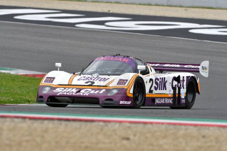 Photo for Scarperia, 2 April 2023: Jaguar XJR-9 year 1988 in action during Mugello Classic 2023 at Mugello Circuit in Italy. - Royalty Free Image