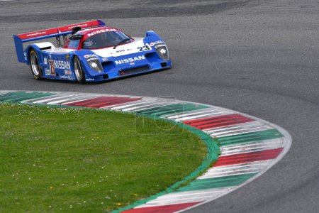 Photo for Scarperia, 2 April 2023: Nissan NPT 90 year 1991 in action during Mugello Classic 2023 at Mugello Circuit in Italy. - Royalty Free Image