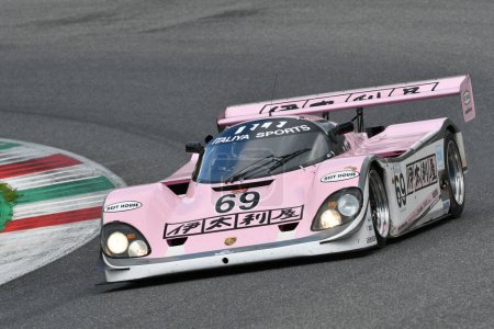 Photo for Scarperia, 2 April 2023: Porsche 962 C year 1990 in action during Mugello Classic 2023 at Mugello Circuit in Italy. - Royalty Free Image