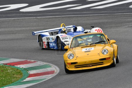 Photo for Scarperia, 2 April 2023: Porsche 993 GT2 year 1996 in action during Mugello Classic 2023 at Mugello Circuit in Italy. - Royalty Free Image