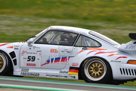 Photo for Scarperia, 2 April 2023: Porsche 993 GT2 Evo year 1999 in action during Mugello Classic 2023 at Mugello Circuit in Italy. - Royalty Free Image