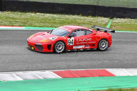 Photo for Scarperia, 2 April 2023: Ferrari F430 GTC Evo 2009 in action during Mugello Classic 2023 at Mugello Circuit in Italy. - Royalty Free Image