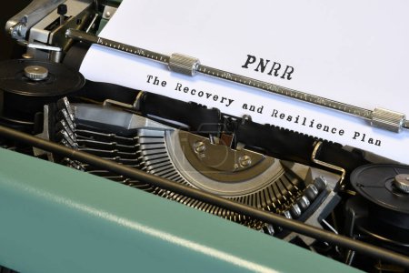 words 'PNRR The National Recovery and Resilience Plan' typed on vintage typewriter. The National Recovery and Resilience Plan is part of the Next Generation programme, that the European Union negotiated in response to the pandemic crisis Covid 19.