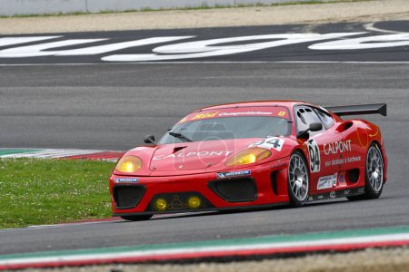 Photo for Scarperia, 2 April 2023: Ferrari 360 Modena N-GT year 2003 in action during Mugello Classic 2023 at Mugello Circuit in Italy. - Royalty Free Image