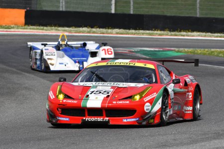 Photo for Scarperia, 2 April 2023: Ferrari 458 GTE year 2011 in action during Mugello Classic 2023 at Mugello Circuit in Italy. - Royalty Free Image