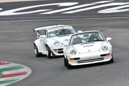 Photo for Scarperia, 2 April 2023: Porsche 993 GT2 year 1995 in action during Mugello Classic 2023 at Mugello Circuit in Italy. - Royalty Free Image