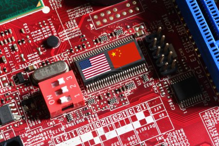 Foto de Flag of the Republic of China and the United States on microchip of a printed electronic board. Concept for world supremacy in microchip and semiconductor manufacturing. - Imagen libre de derechos