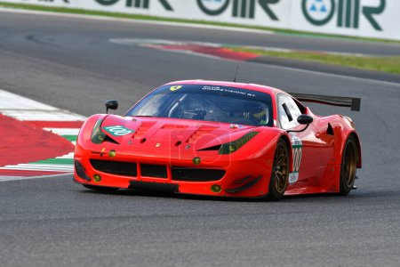 Photo for Scarperia - Italy, 28 October 2023: Ferrari 458 GT2 in action at the Mugello Circuit during Ferrari World Finals 2023 in italy. - Royalty Free Image