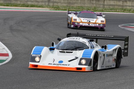 Photo for Scarperia, 5 April 2024: Porsche 962 C group C year 1990 in action during Mugello Classic 2024 at Mugello Circuit in Italy. - Royalty Free Image