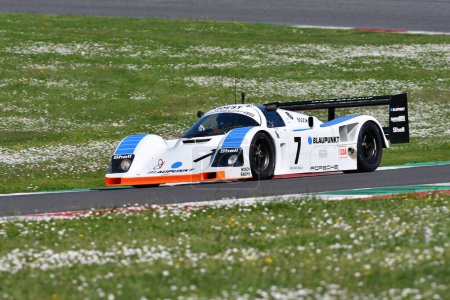 Photo for Scarperia, 5 April 2024: Porsche 962 C group C year 1990 in action during Mugello Classic 2024 at Mugello Circuit in Italy. - Royalty Free Image