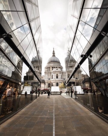 Photo for Symmetrical view of the St. Paul's Cathedral captured from the One New Change shopping mall in central London. Reflections in windows - Royalty Free Image