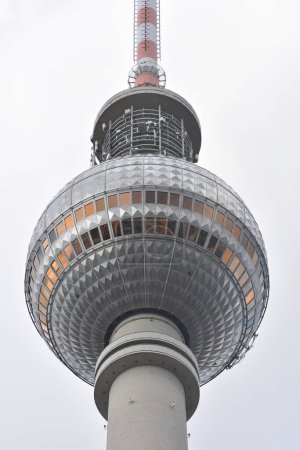 Photo for Close-up of The Berliner Fernsehturm (Berlin TV tower) next to the Alexanderplatz, set against a cloudy background - Royalty Free Image