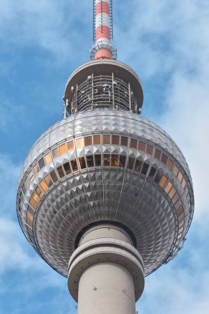 Photo for Close-up of The Berliner Fernsehturm (Berlin TV tower) next to the Alexanderplatz, set against a partly cloudy sky - Royalty Free Image