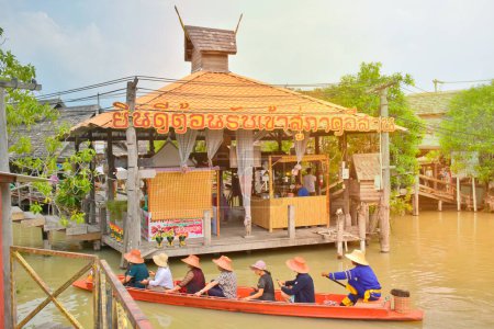 Photo for Traditional floating market with people traveling on boats in old-style houses in the evening in Thailand, Pattaya 8 October 2019. - Royalty Free Image