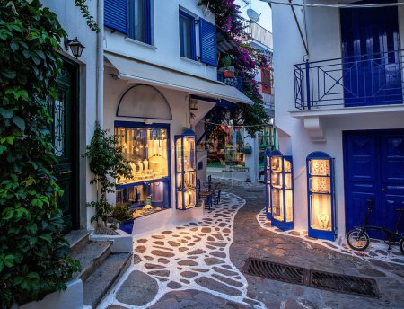 Photo for Beautiful old, narrow alley with cobblestone in Skiathos, Greece - Royalty Free Image