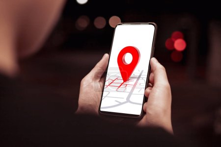 Destination red pin, Global Positioning System (GPS) and navigation map concept. Young woman's hand searching for location in online map on smartphone