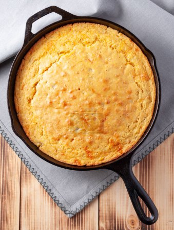 Southwest cheesy buttermilk cornbread with green chilies in a cast iron skillet
