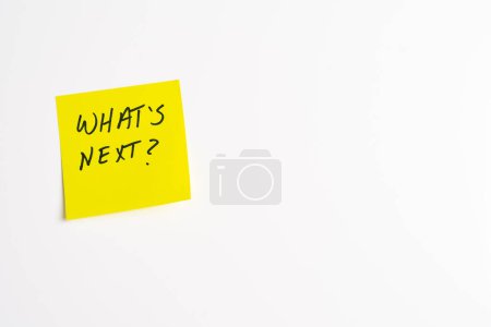 The words What's Next on a yellow sticky note posted on an isolated white background