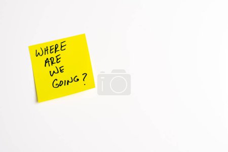 The words Where Are We Going on a yellow sticky note posted on an isolated white background