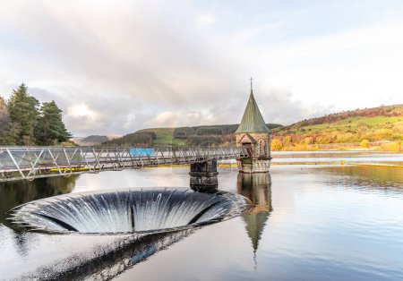 Brecon Beacons Pontsticill Reservoir in Merthyr Tydfil Wales with rainbow in the distance.