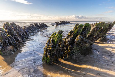 The wreck of the Norwegian ship SS Nornen which ran aground on the beach at Berrow near Burnham-on-Sea, UK in 1897 due to gale force winds.