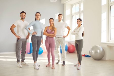 Photo for Group portrait of a team of sport people at the gym. Friends share smiles and determination, illustrating the power of togetherness in fitness journey and training sessions together. - Royalty Free Image