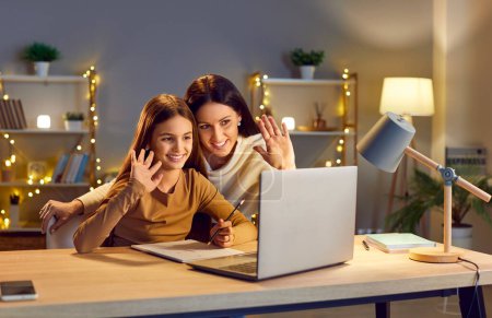 Online video call and chat interaction, mother and daughter communicating via laptop. Happy family making visual call, greeting, talking, videoconferencing with parent, friends, distant family member