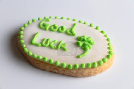 Photo for Shot of a cookie with "good luck" written on it with a clove on a white background - Royalty Free Image