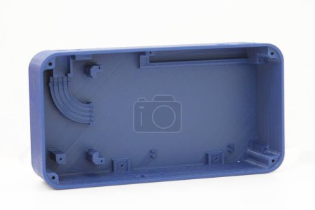 Photo for 3d printing blue plastic case isolated on white background, produced from pla, horizontal view, macro - Royalty Free Image