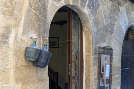 Photo for Discover the charming entrance to a picturesque winery in the charming old town of Laguardia. Adorned with rustic wine jugs, this hidden gem in the province of Vitoria invites you to savor its rich history and exceptional vintages. Explore Laguardia' - Royalty Free Image