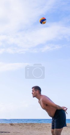 Beach volleyball player signaling to his partner