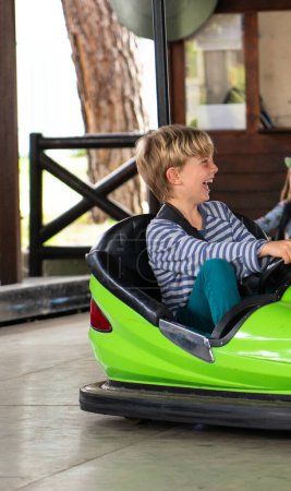 Boy laughing in bumper cars