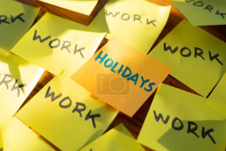 Photo for Many Post it with the word work and one in the center with the word holidays. Vacation time - Royalty Free Image