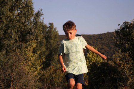 child running on rocks in nature