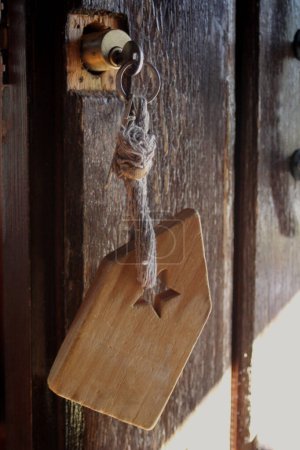Rural house key hanging from the door