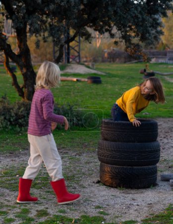 Children playing with wheels outdoors