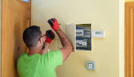 Electrician man working in a house