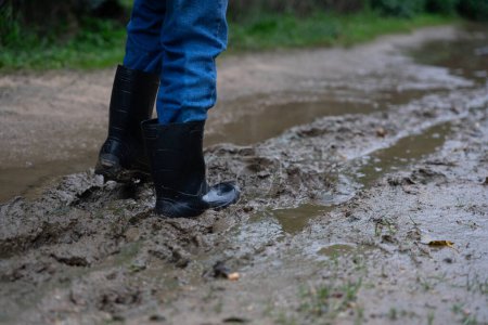 A child's wellies on mud