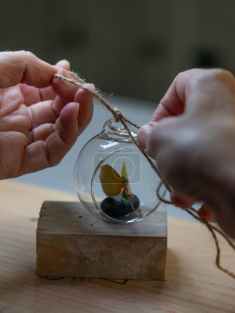 Artisan woman making handicrafts seen up close