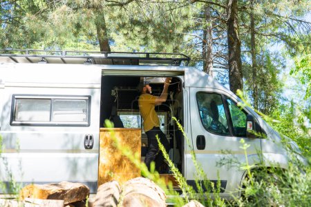 Man customizing a camper van