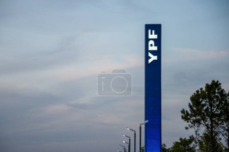 Photo for Luminous sign of a gas station of the oil company YPF on October 12, 2022, Dolores city, Buenos Aires province, Argentina. - Royalty Free Image